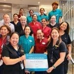 A group of staff from Middle Swan Residential Care holding the facility's Certificate of Accreditation