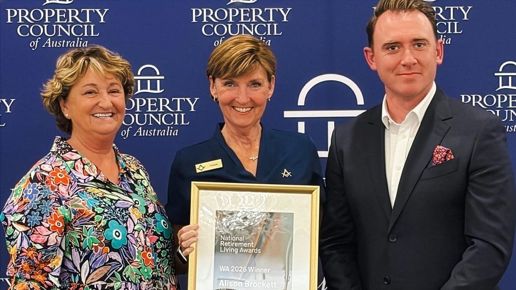 Retiremnt Living Council team celebrates Allison Brocket as the 2026 WA Village Manager of the Year recipient at the Property Council of Australia Awards, holding the framed trophy alongside colleagues