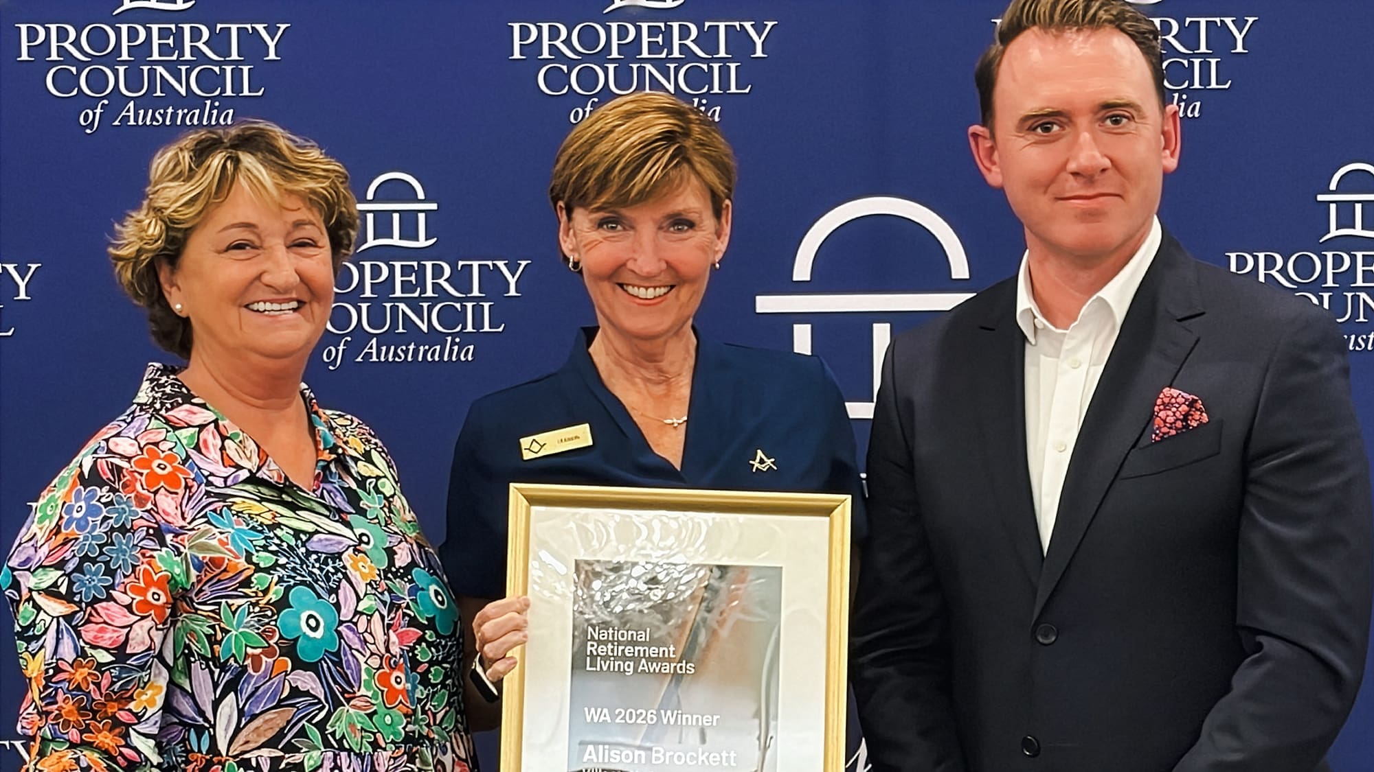 Retiremnt Living Council team celebrates Allison Brocket as the 2026 WA Village Manager of the Year recipient at the Property Council of Australia Awards, holding the framed trophy alongside colleagues